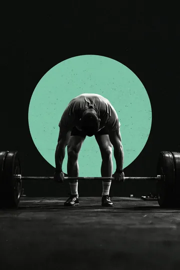 A lifter setting up a deadlift under a green moon, black and white.